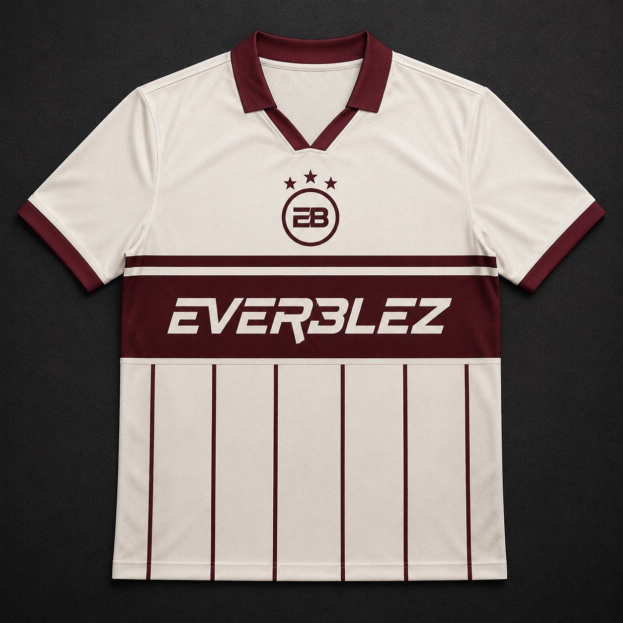 Everblez cream jersey with burgundy collar, EB crest with three stars, EVERBLEZ chest band and vertical pinstripes